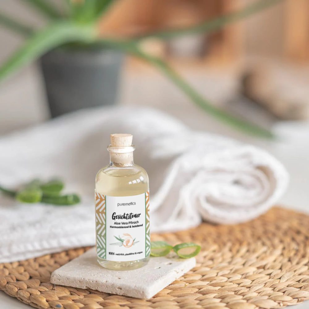 Gesichtstoner Aloe Vera Pfirsich - Sanfte Reinigung und Feuchtigkeit Hintergrund