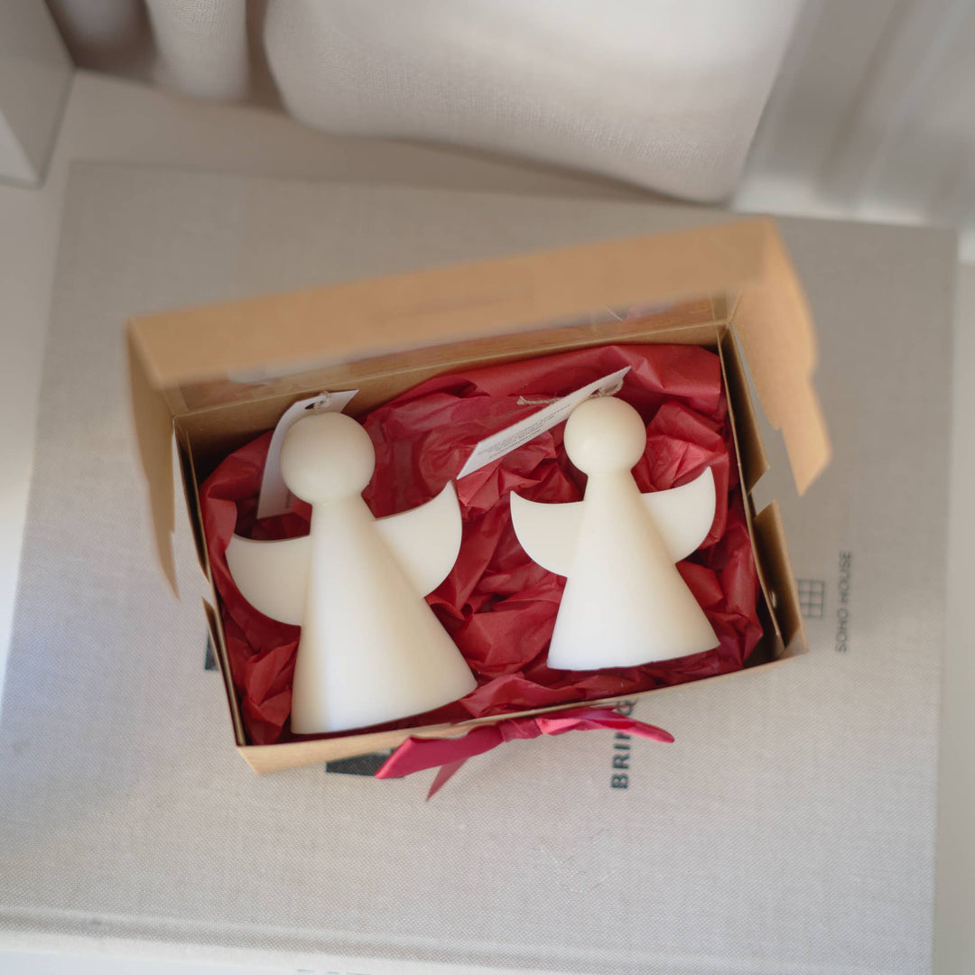 Zwei Engel-Kerzen Éden & Solal in der geöffneten Geschenkbox